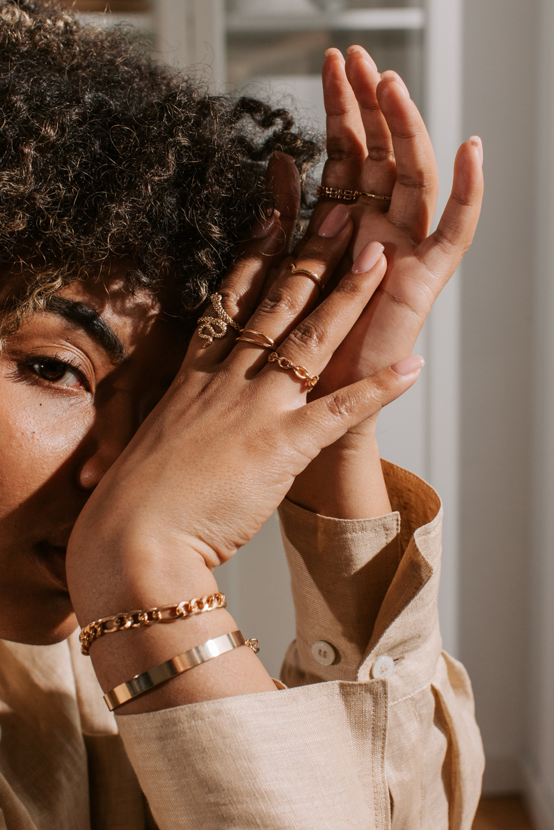 Woman Wearing Gold Jewelry