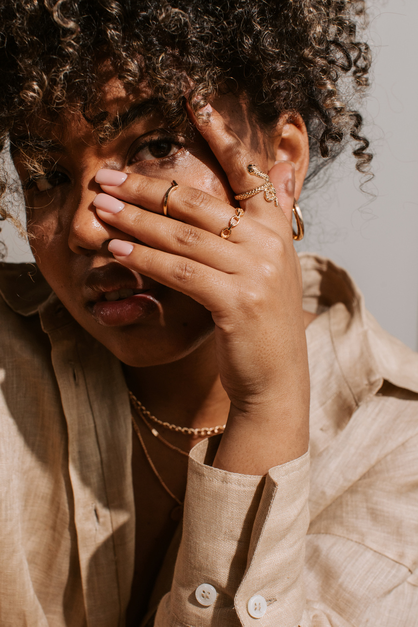 Woman Wearing Gold Jewelry